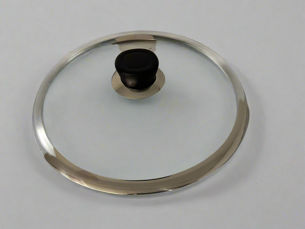 Glass lid with metal rim on a white background