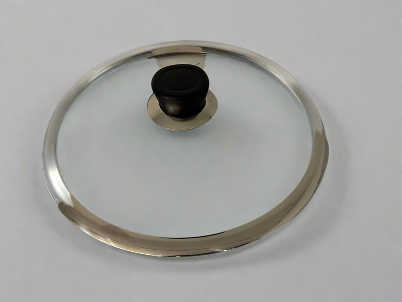 Glass lid with metal rim on a white background
